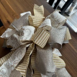 Extra large, gold and silver and champagne bow for treetop with streamers